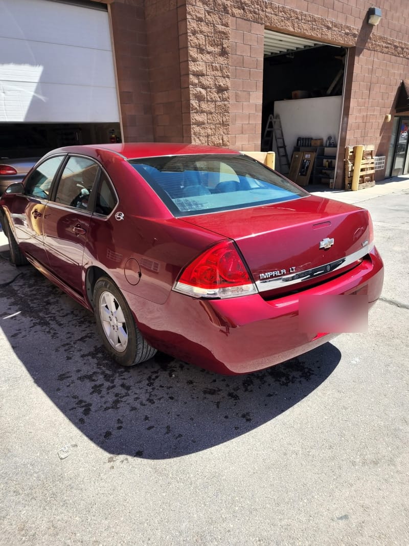 Rear three-quarter view of the finished Impala on the shop forecourt