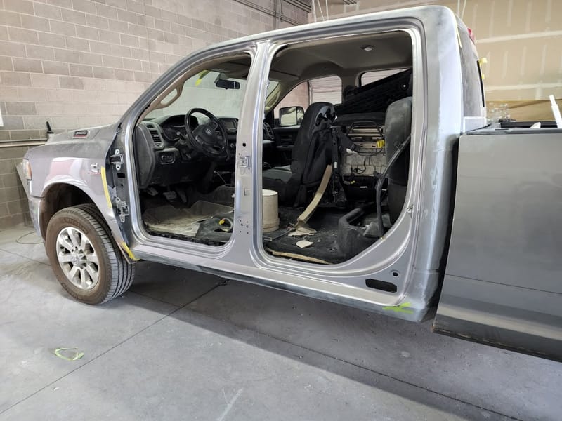 The Ram with its door opening straightened and masked, doors still off